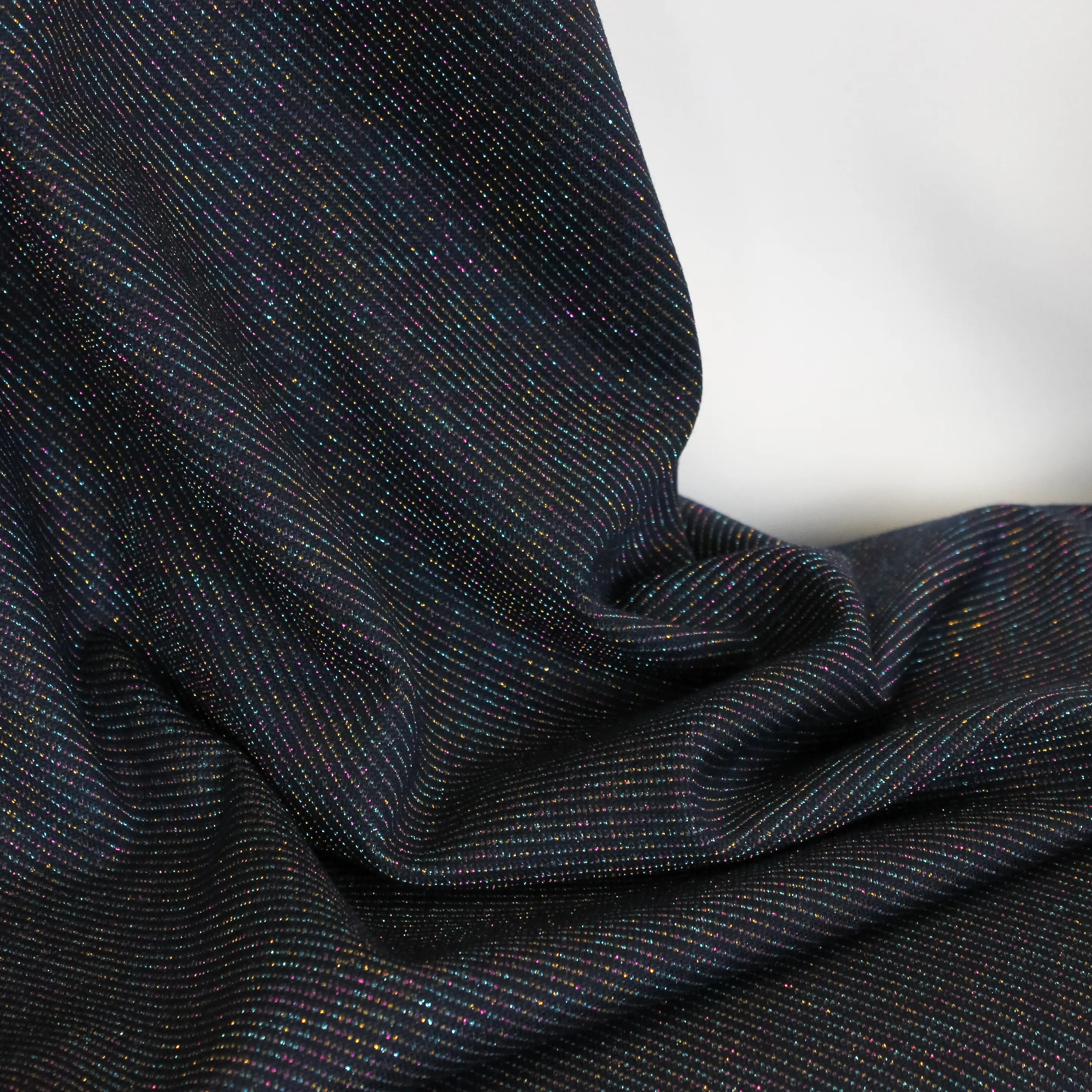 Tricot donker blauw met glitter gestreept